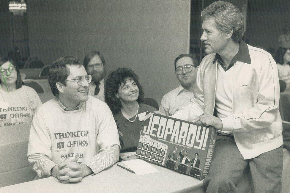 Trebek speaks to contestants from Canada before a taping