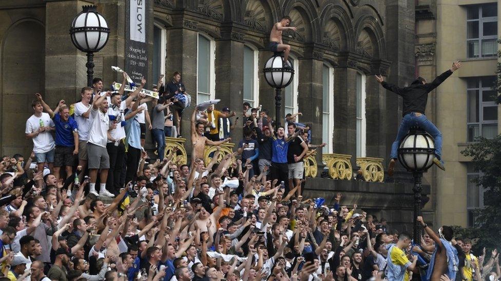 Fans celebrating in Millennium Square, Leeds