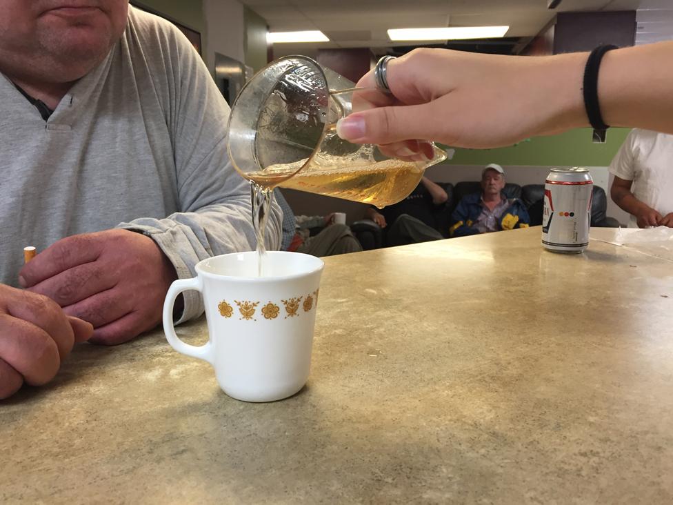 Pouring wine for a resident