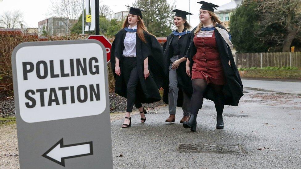 Students go to vote in their gowns