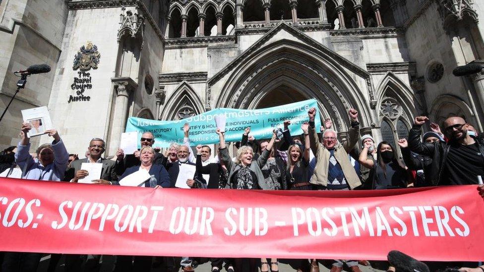 The only sub-postmasters to have had their convictions overturned so far seen celebrating outside the Royal Courts of Justice.