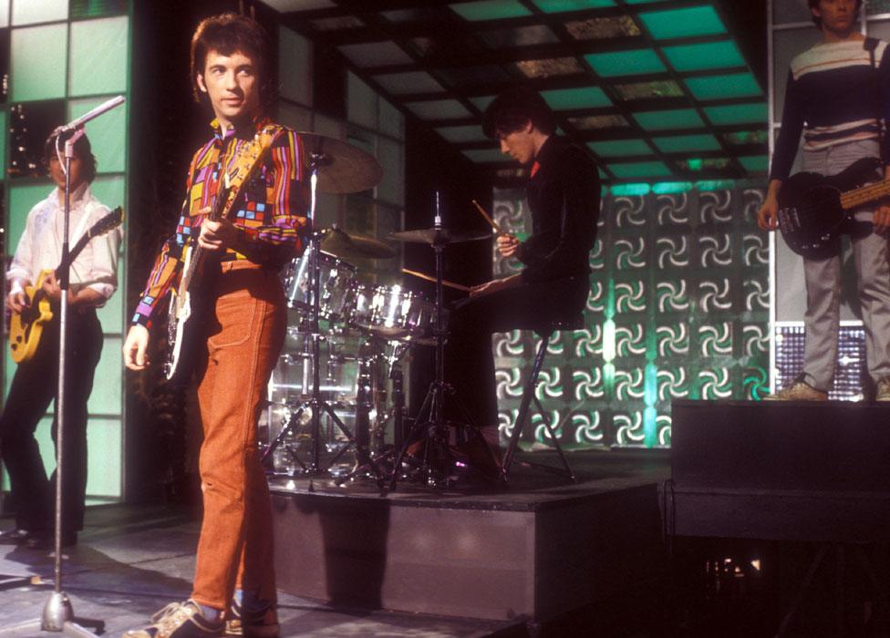 John Maher playing drums with the Buzzcocks