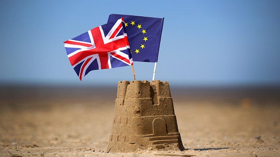 Sand castle with EU and Union flags