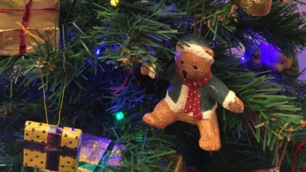 Teddy bear ornament on Christmas tree