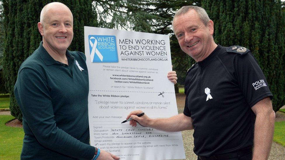 Deputy Chief Constable Iain Livingstone signs the white Ribbon pledge