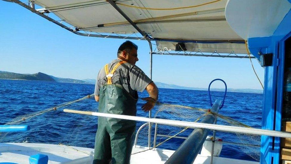 Fisherman off the coast of Greece