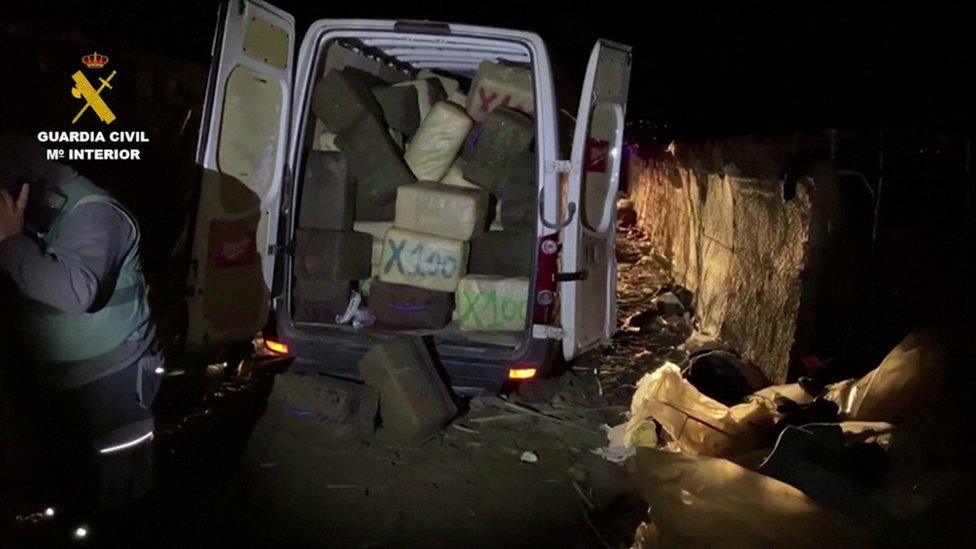 A truck with boxes in the back of it