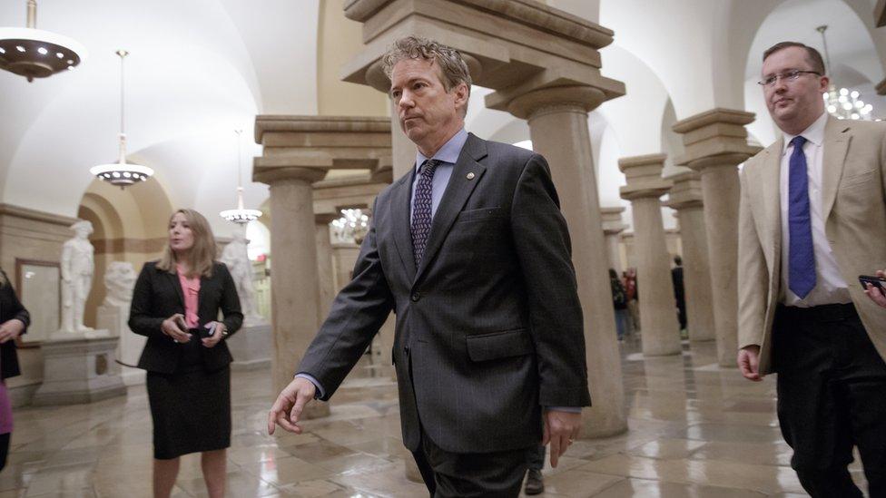 Senator Rand Paul walks to a room on Capitol Hill in Washington on 2 March 2017