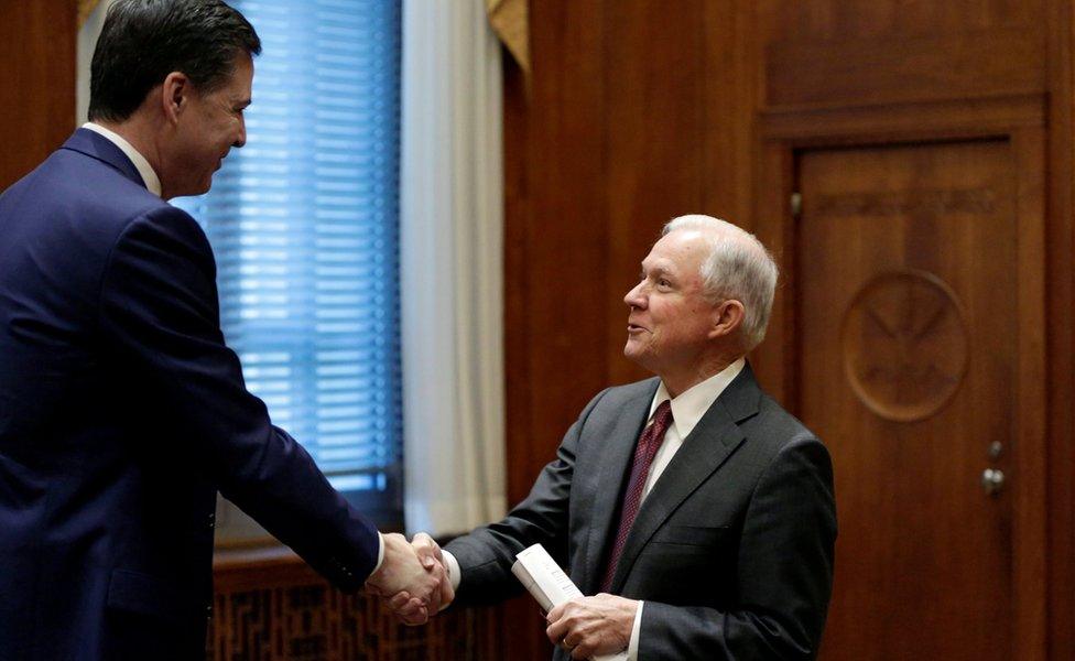 U.S. Attorney General Jeff Sessions (R) shakes hands with FBI Director James Comey before his first meeting with heads of federal law enforcement components at the Justice Department in Washington, U.S., February 9, 2017