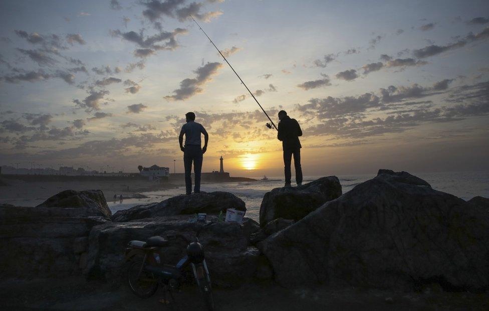 Fishermen wait for a catch on Rabat beach, Morocco, on Wednesday, Nov. 2, 2016. Rabat beach is a hub for families