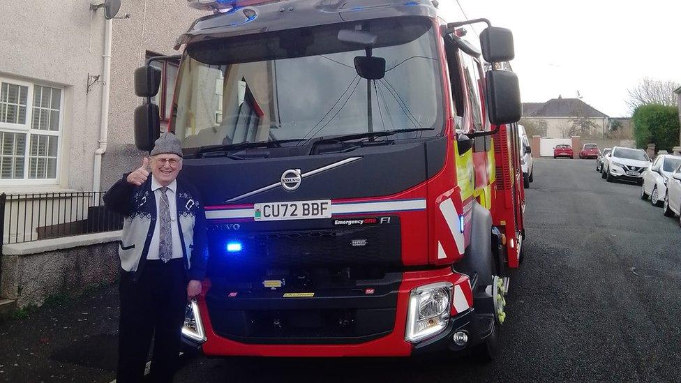 Jeffrey Edwards standing by a fire engine on the morning the shell was taken away