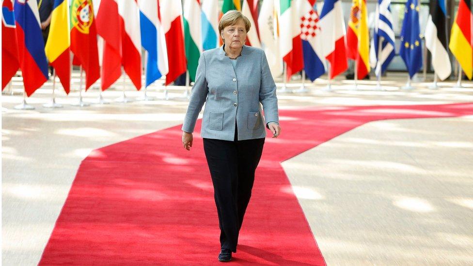 Angela Merkel arriving at talks in Brussels (29 April)