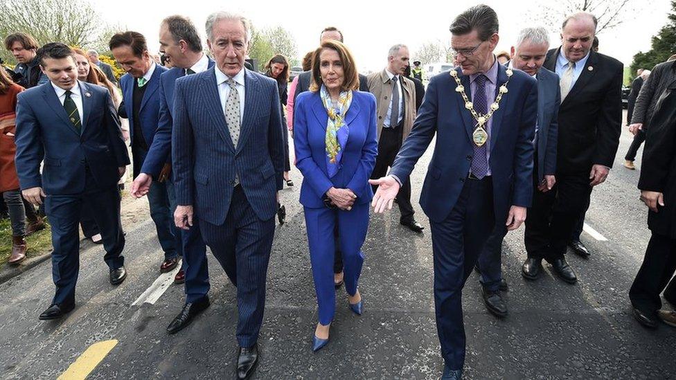 Mayor of Derry, John Boyle, steps over the Irish border with US Speaker Nancy Pelosi