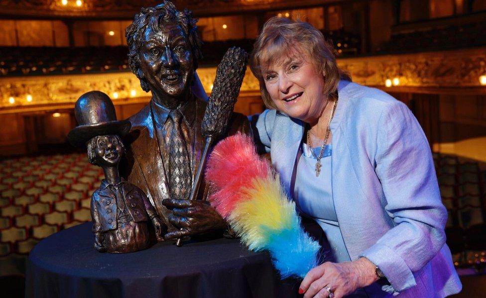 Lady Anne Dodd with sculpture of Sir Ken Dodd