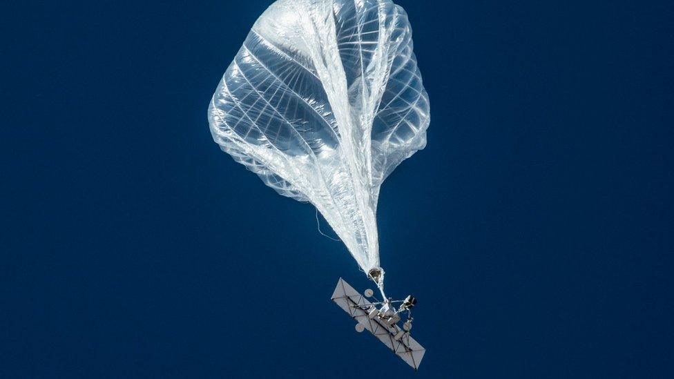 A solar-powered transmitter hanging from a balloon