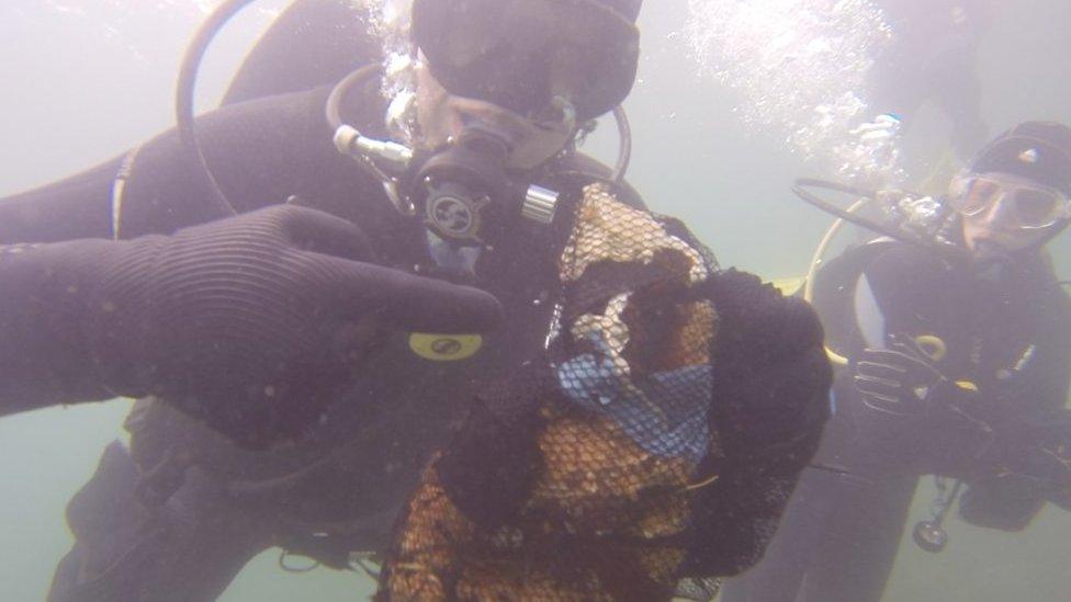 They pick up litter underwater along the North East coast as they dive.