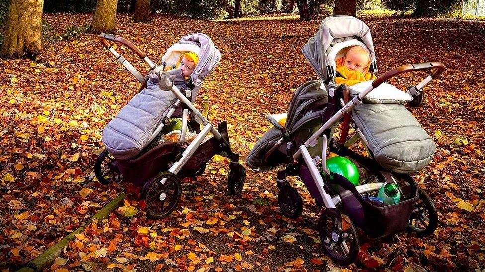 The triplets in pushchairs