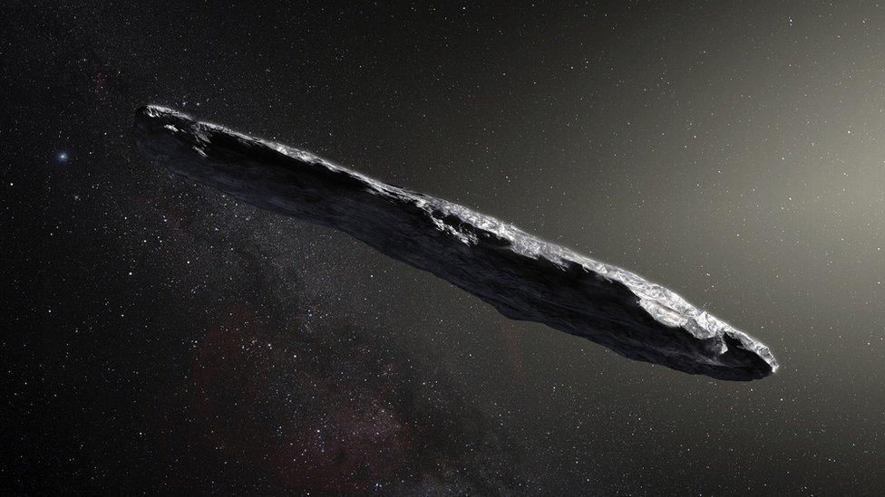 Artist's impression of Oumuamua, a long, cigar shaped object