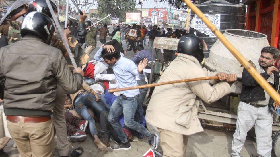 In this photo taken on December 19, 2019 police beat protesters with sticks during a demonstration against India's new citizenship law in Lucknow