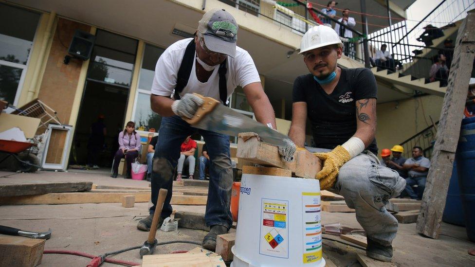 Carpenters construct support beams that could help stabilise the collapsed Enrique Rébsamen school, Mexico City, 20 September 2017