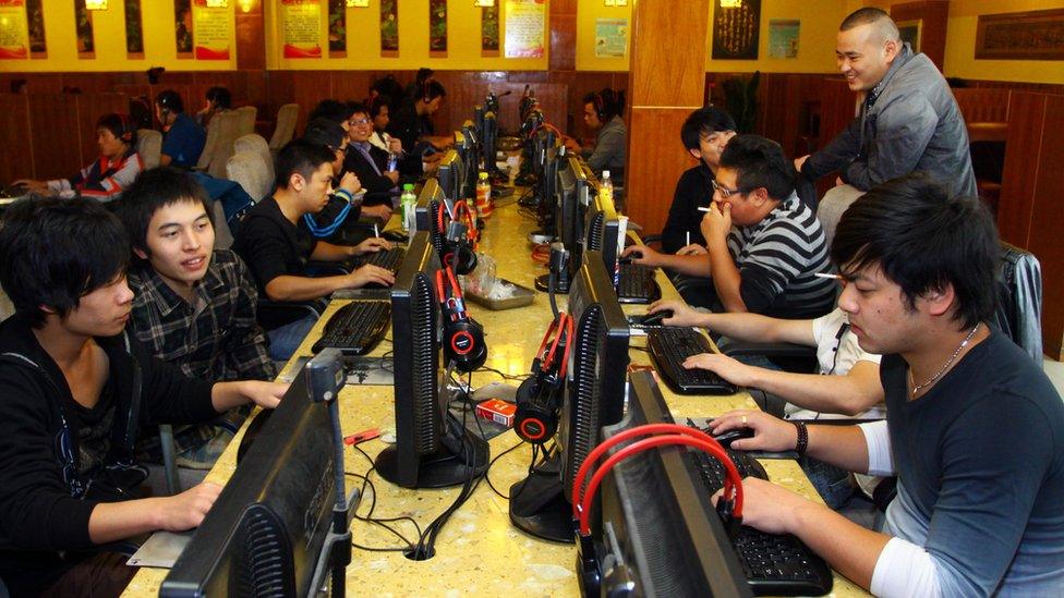 A group of people at an Internet cafe in Jiashan, east China's Zhejiang province, November 2012