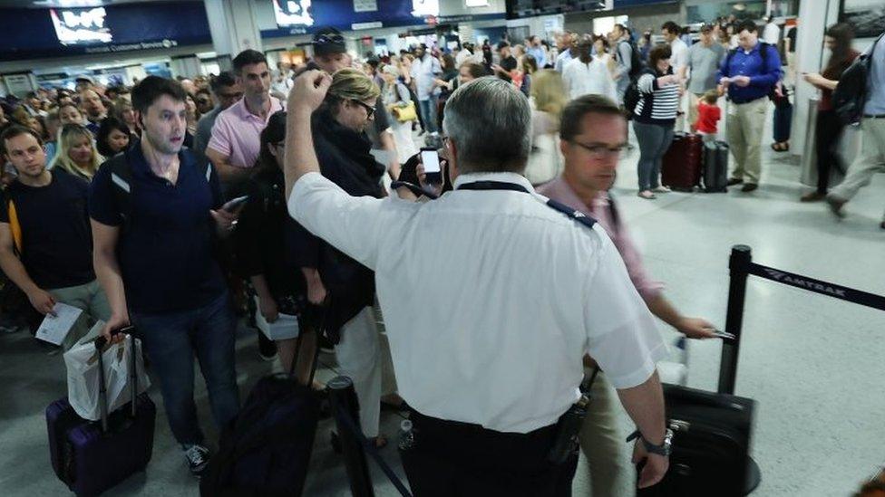 Large crowds rush to leave New York's Pennsylvania station before the start of the Labor Day holiday weekend