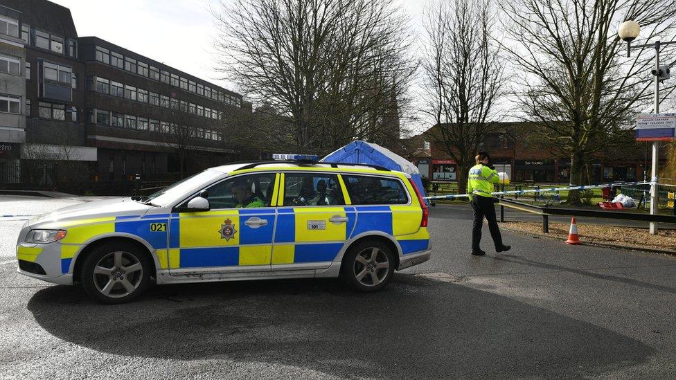 Police officers next to a cordon near to a bench in the Maltings in Salisbury