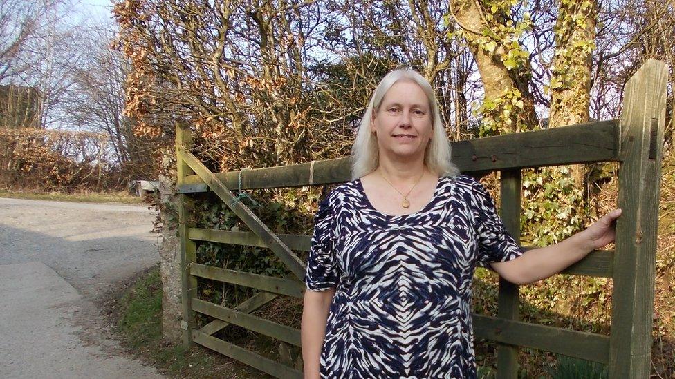 Caroline Barlow standing at a gate