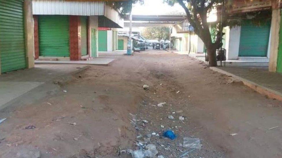 A picture showing closed shops in an area in Sudan.