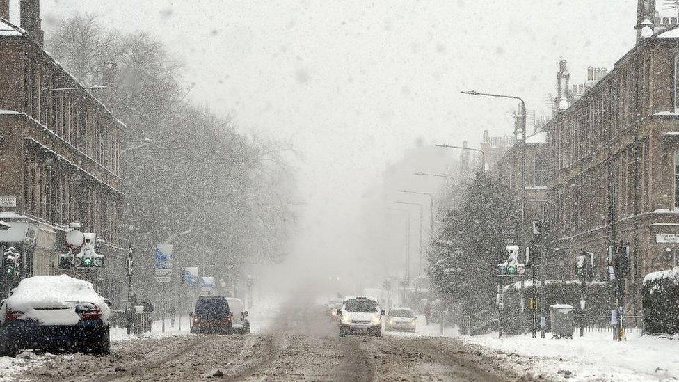 Snow falls in Glasgow with fresh heavy snowfalls and icy blizzards.