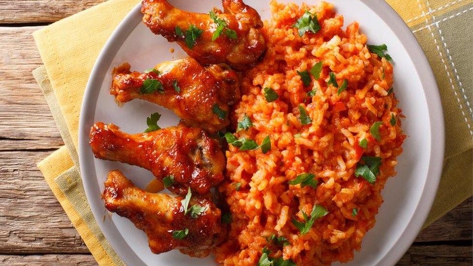 Nigerian jollof rice with fried chicken wings