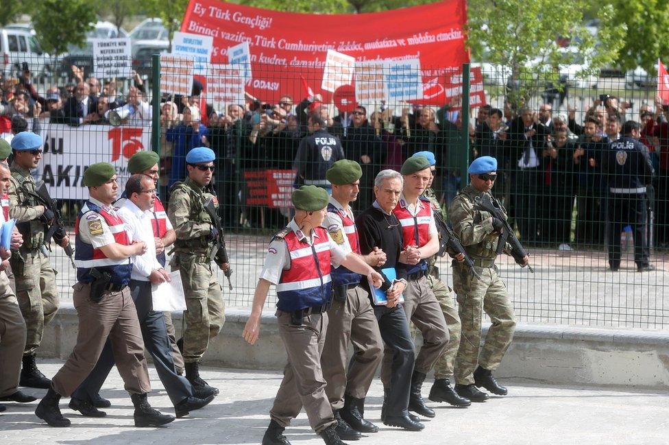 Ex-air force chief Akin Ozturk heads parade of defendants outside court