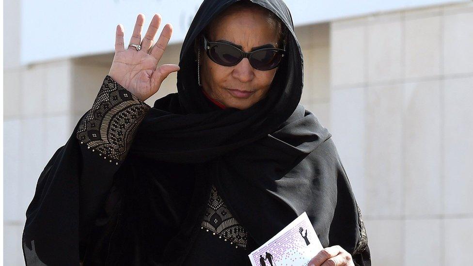 Saudi election candidate Amal Badreldin al-Sawari waves after casting her ballot in Riyadh