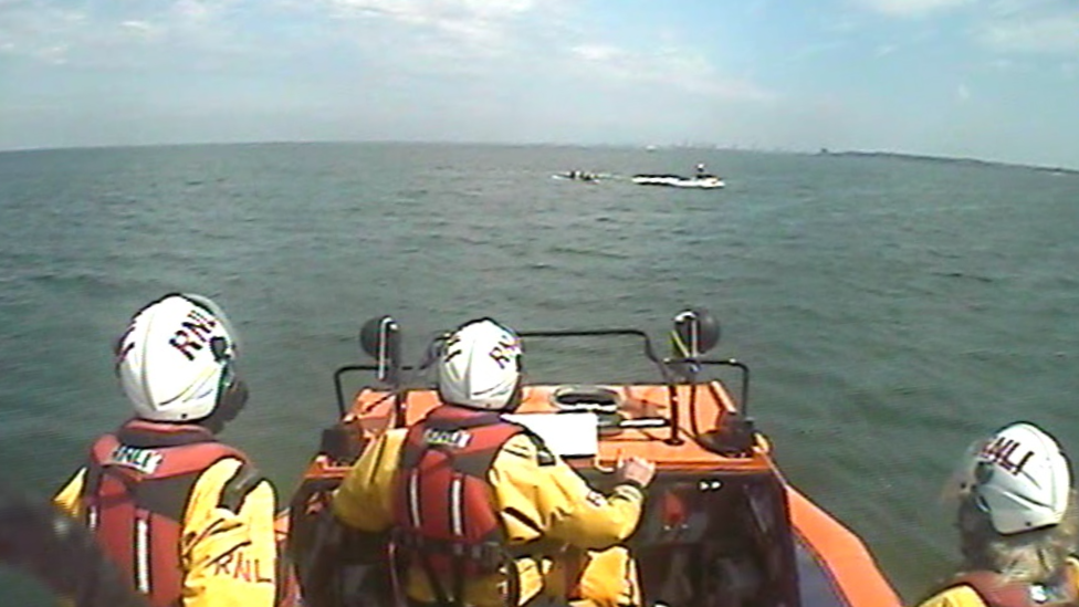 Paddle boarders being rescued by Hoylake RNLI volunteers