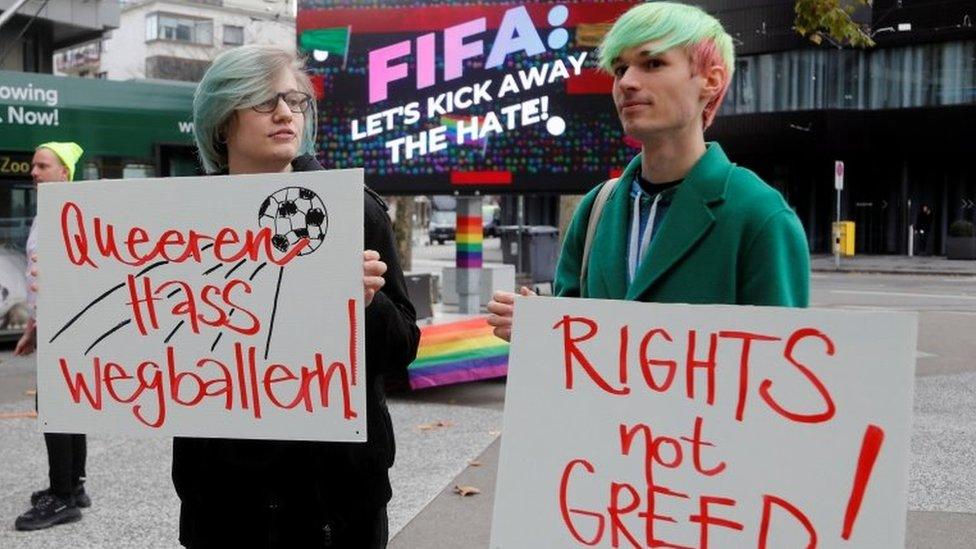 Protestors in Switzerland kiss during a rally to raise awareness of the human rights situation of LGBT people in Qatar