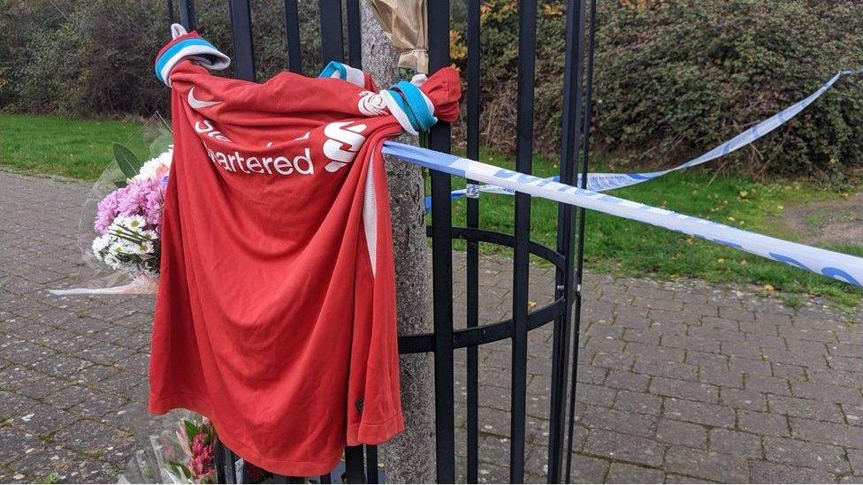 Football shirt tied to railings