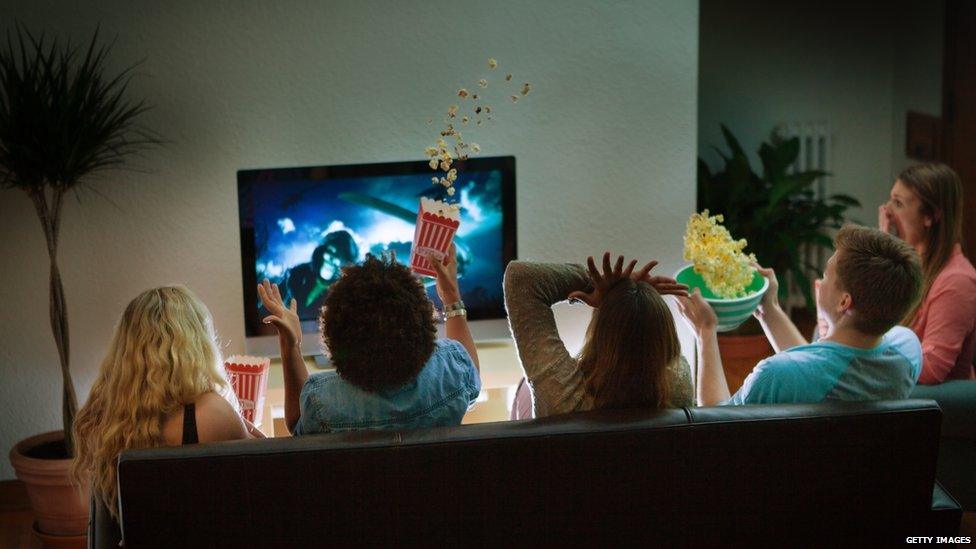 Group of friends watching TV