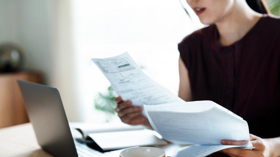 Woman looking at documents