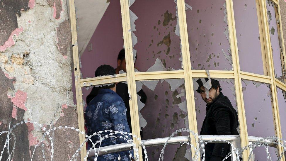 Broken windows in Kabul following a Taliban attack