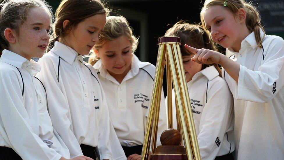 Young-cricketers-look-at-the-womens-ashes-trophy