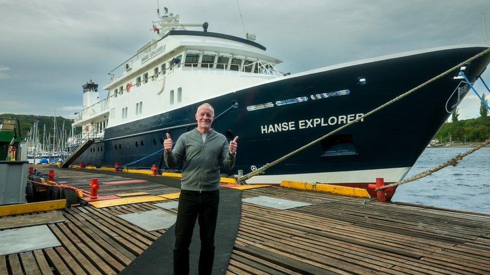 Chris Brown in front of the Hanse Explorer
