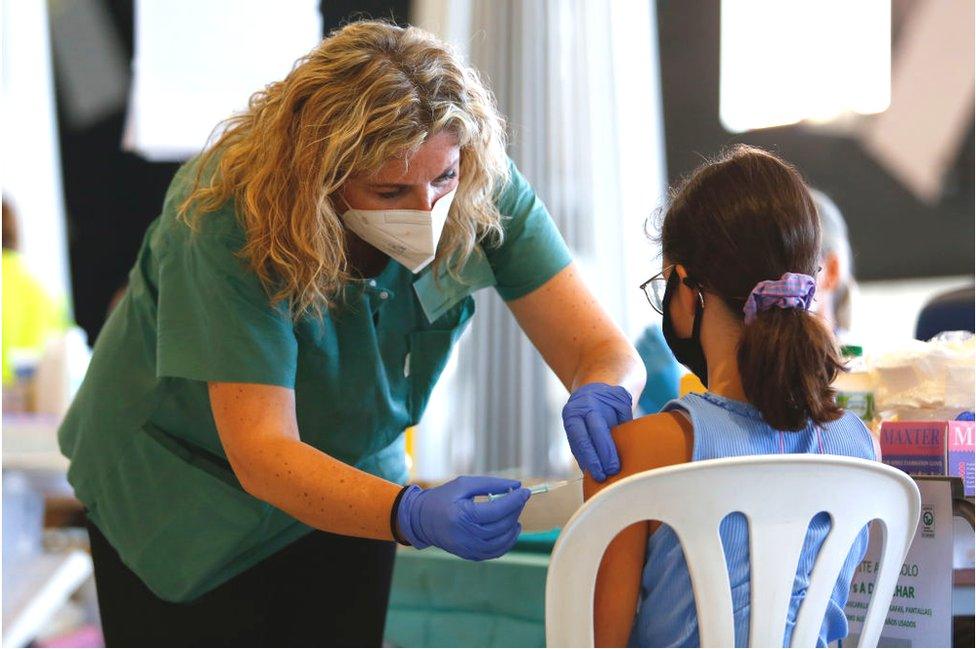 young girl vaccinated