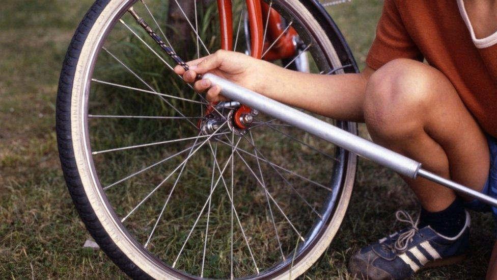 Pumping up bike tyre