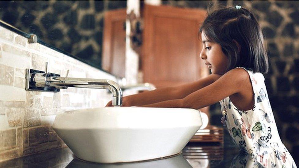 girl washing hands