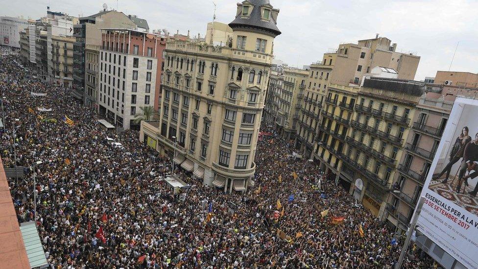 Protesters gather at the Place de la Universitat square in Barcelona on 3 October