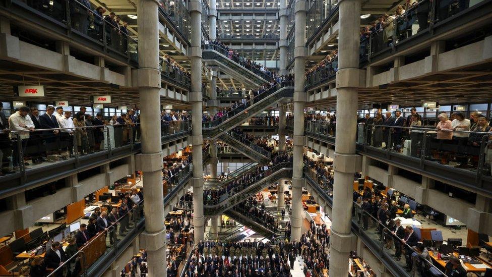 Employees line the balconies of the Lloyd's of London building during the two-minute silence.