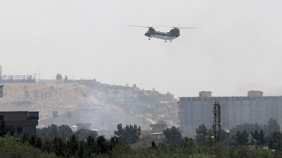 A US military helicopter is pictured flying above the US embassy in Kabul