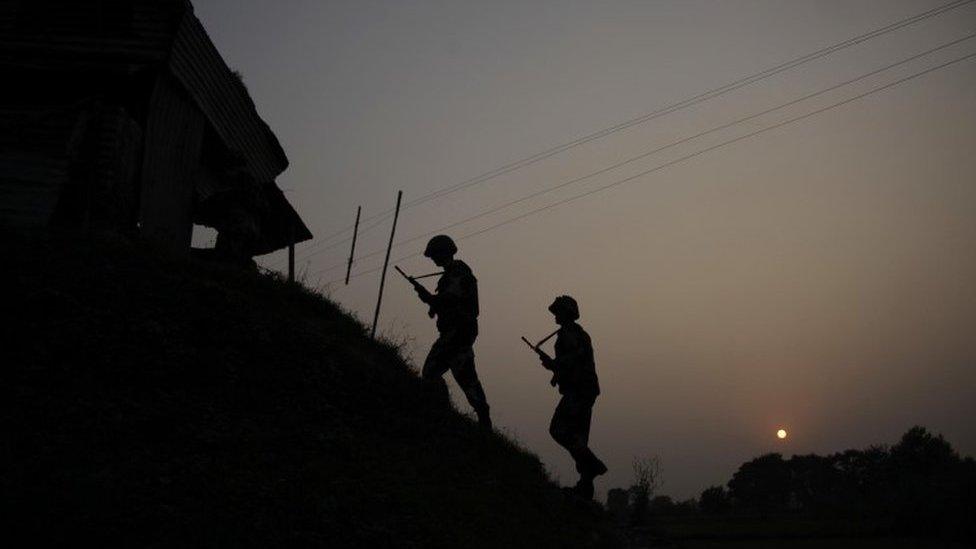 Indian Border Security Force soldiers patrol near the India-Pakistan international border area at Gakhrial border post in Akhnoor sector, about 48 kilometers from Jammu, India, Saturday, Oct. 1, 2016. In