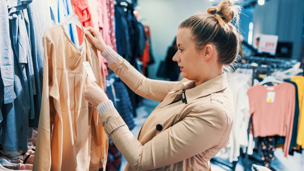 Young woman in a clothes shop