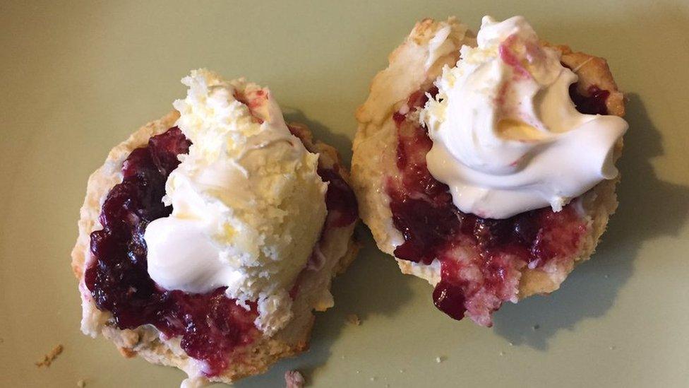 Cream tea with jam on first